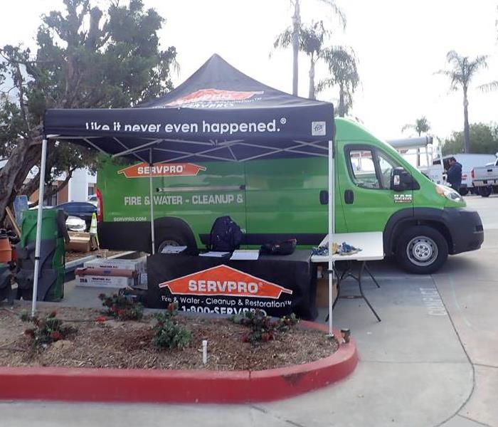 SERVPRO van by a "Like it never even happened," tent.