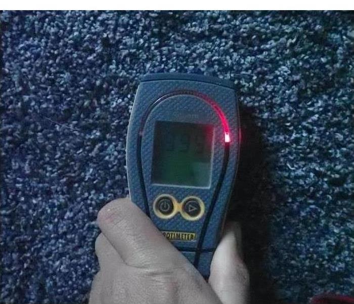 Moisture meter on a carpet